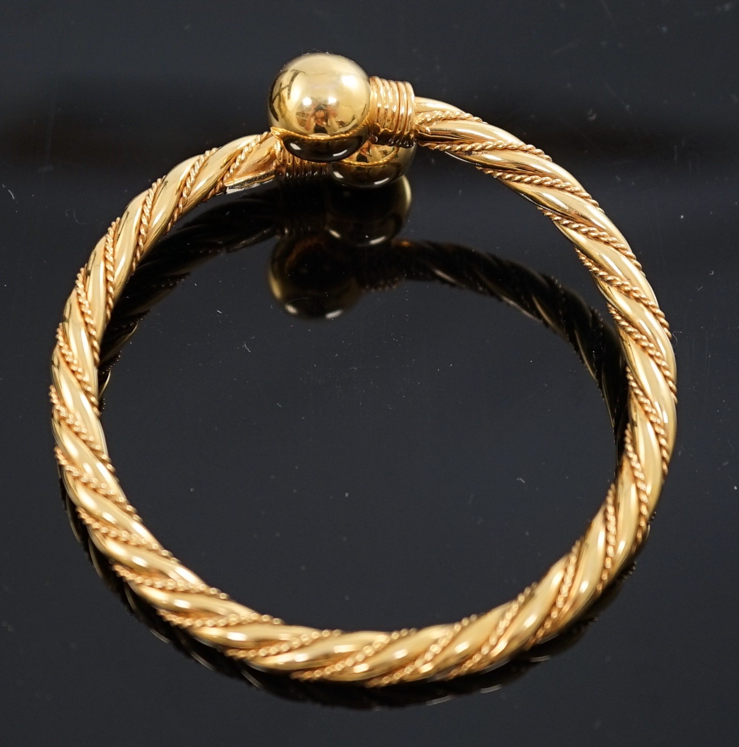 A modern Italian 18k gold open work bangle